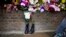 FILE - Military boots are displayed outside London's Woolwich Barracks in tribute to British soldier Lee Rigby killed nearby in May.