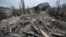 Rescuers work at the site of a maternity ward of a hospital destroyed by a Russian missile attack, as their attack on Ukraine continues, in Vilniansk, Zaporizhzhia region, Ukraine, Nov. 23, 2022. 