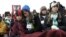 A crowd listens to speaker during a rally against gun violence near the Washington Monument in Washington, January 26, 2012. 