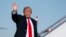 President Donald Trump waves as he boards Air Force One, Jan. 18, 2018, at Andrews Air Force Base, Md. 