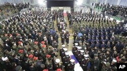 South Korean marines carry two flag-draped caskets containing the remains of marines killed in Tuesday's North Korean bombardment during a funeral service at a military hospital in Seongnam, South Korea, 27 Nov 2010