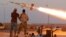 Fighters of Libyan forces allied with the U.N.-backed government fire a rocket at Islamic State fighters in Sirte, Libya, Aug. 4, 2016. 