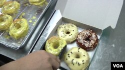Halo Doughnut is one of tens of thousands of microbusinesses that have started in Malaysia during the past few months. (Dave Grunebaum/VOA)