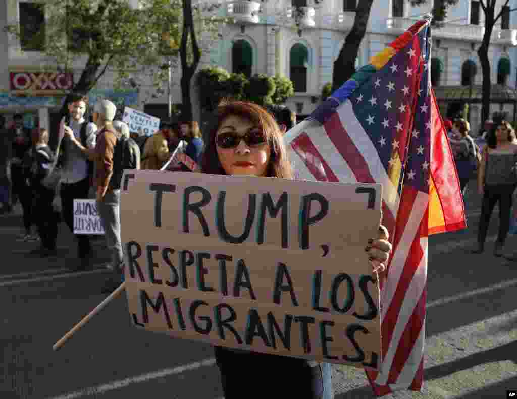 A woman holds a sign that reads in Spanish &quot;Trump, respect migrants&quot; during a march called by a local women&#39;s movement against U.S. President Donald Trump in Mexico City, Friday, Jan. 20, 2017. Donald Trump became the 45th president of the United States Friday, Jan. 20 2017, amid apprehension in Mexico regarding his previous comments about Mexico and his promise to build a border wall to halt migration. (AP Photo/Eduardo Verdugo)