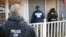 FILE - U.S. Immigration and Customs Enforcement, ICE agents at a home in Atlanta, Georgia.