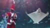 A diver clad in Santa Claus outfit performs amongst fish during a Christmas-themed underwater show at an aquarium in Seoul on December 4, 2019. - Christmas is one of the biggest holidays celebrated in South Korea.