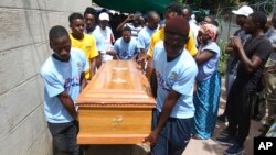 FILE: Soccer teammates of Kelvin Tinashe Choto carry his coffin, during his funeral in Chitungwiza, about 30 kilometres south east of the capital, Harare, Zimbabwe, Saturday, Jan, 19, 2019.