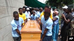 FILE: Soccer teammates of Kelvin Tinashe Choto carry his coffin, during his funeral in Chitungwiza, about 30 kilometres south east of the capital, Harare, Zimbabwe, Saturday, Jan, 19, 2019. He was shot dead by security forces.