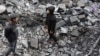 Palestinian children inspect damage at the site of an Israeli strike the previous night in Jabaliya, Gaza Strip, on Jan. 1, 2025.