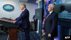 U.S. President Donald Trump with Vice President Mike Pence, right, delivers remarks on the stock market during an unscheduled appearance in the Brady Briefing Room of the White House in Washington on Nov. 24, 2020. 