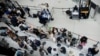 Passengers line up at a security checkpoint in Terminal 1 of John F. Kennedy International Airport one day after a global internet outage, in New York, on July 20, 2024.