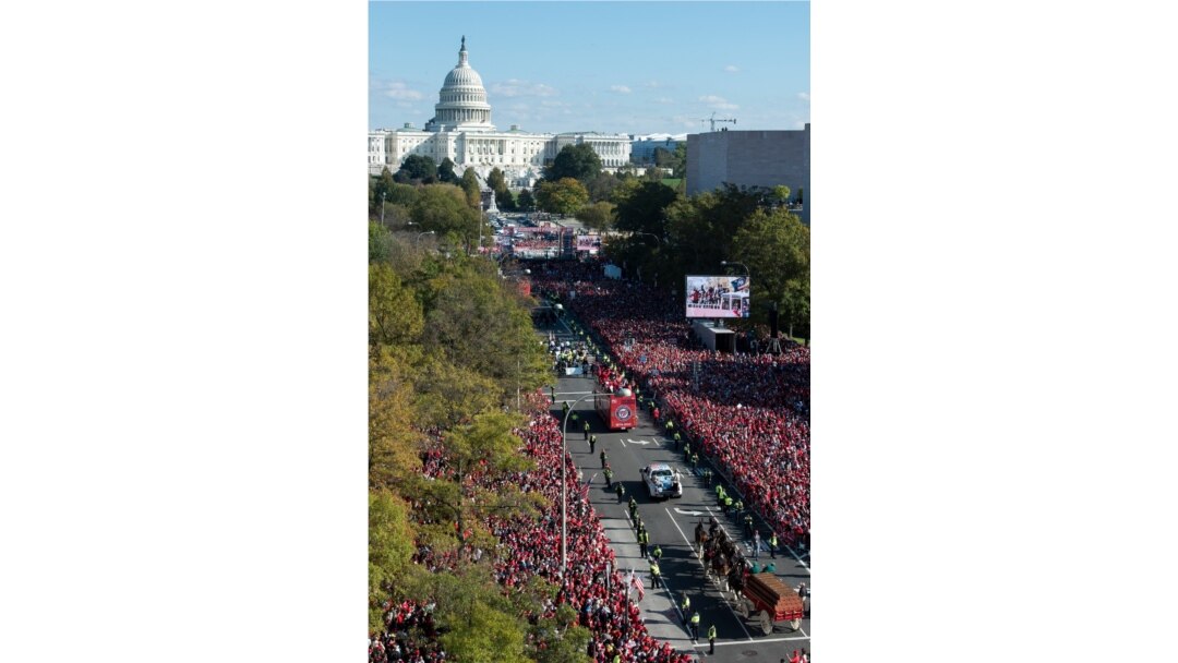 With the Capitol in the background, the Washington Nationals celebrate the team's World Series baseball championship over the Houston Astros, with their fans in Washington, Nov. 2, 2019.
