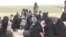 As families evacuate the last enclave of IS fighters in Baghuz, many are sick or injured with nearly 140 people dying in recent weeks, pictured near Baghuz on Feb. 26, 2019. (H.Murdock/VOA)