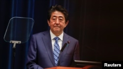 Japan's Prime Minister Shinzo Abe attends a news conference on Japan's response to the coronavirus outbreak at his official residence in Tokyo, Japan, March 14, 2020. 