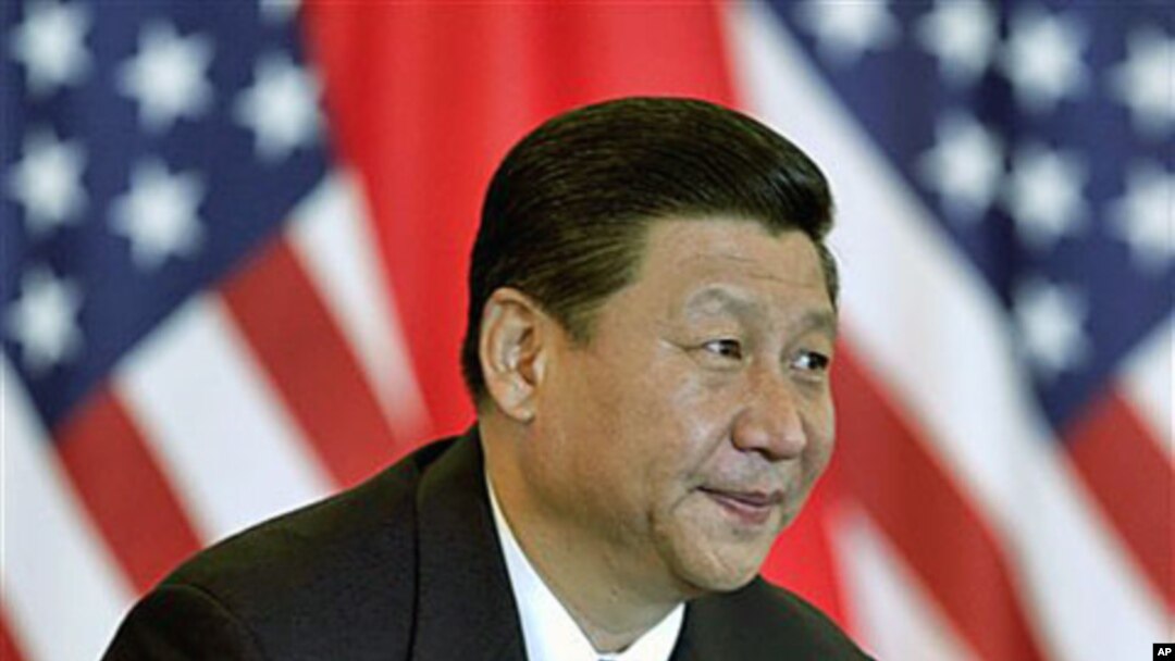 Chinese Vice President Xi Jinping and US counterpart Joe Biden [no shown] attend a meeting with US and Chinese business leaders at the Beijing Hotel in Beijing, China, August 19, 2011.