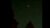 In this image taken from video, what appears to be a drone is seen above treetops in Flanders, New Jersey, Dec. 3, 2024. 