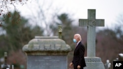 FILE - Then U.S. President-elect Joe Biden departs the St. Joseph on the Brandywine Catholic Church in Wilmington, Delaware, Jan. 16, 2021.