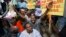 FILE - Demonstrators chant anti-electoral council slogans during a rally protesting against what they claim are fraudulent elections results in Port-au-Prince, Haiti, Dec. 16, 2015.