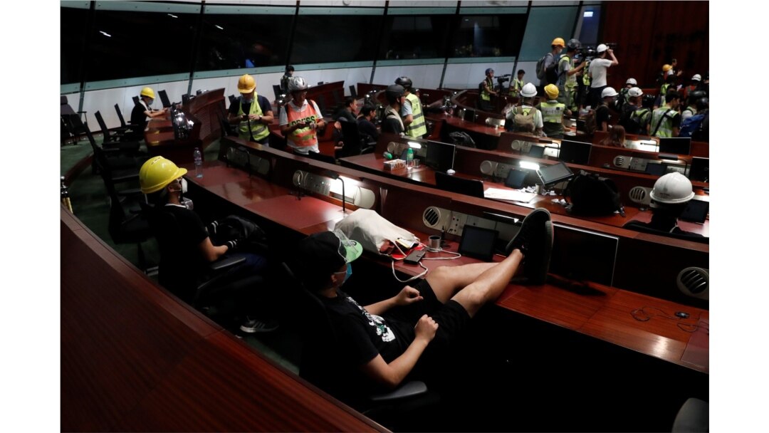 Anti-extradition bill protesters are seen inside a chamber after they broke into the Legislative Council building during the anniversary of Hong Kong's handover to China in Hong Kong, July 1, 2019. (Reuters)