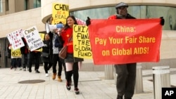 Advocates from the AIDS Healthcare Foundation and other community organizations demonstrate outside the Chinese Embassy, Jan. 28, 2017 in Washington, D.C. The demonstration is part of the “Fund the Fund” advocacy campaign, which calls on China, the world’s second largest economic power, to support the Global Fund to Fight AIDS, Tuberculosis and Malaria by making a $1 billion contribution. 