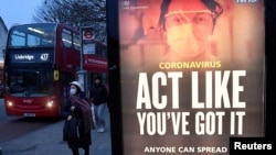 A public health information message is seen at a bus stop in West Ealing as the South African variant of the novel coronavirus is reported in parts of the United Kingdom amid the spread of the coronavirus, London, Britain, Feb. 1, 2021.