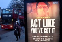 A public health information message is seen at a bus stop in West Ealing as the South African variant of the novel coronavirus is reported in parts of the United Kingdom amid the spread of the coronavirus, London, Britain, Feb. 1, 2021.