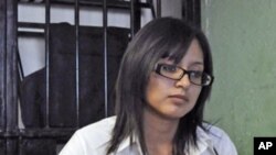 Marisol Valles, 20, sits at her desk at the police station in Praxedis G. Guerrero (file photo)