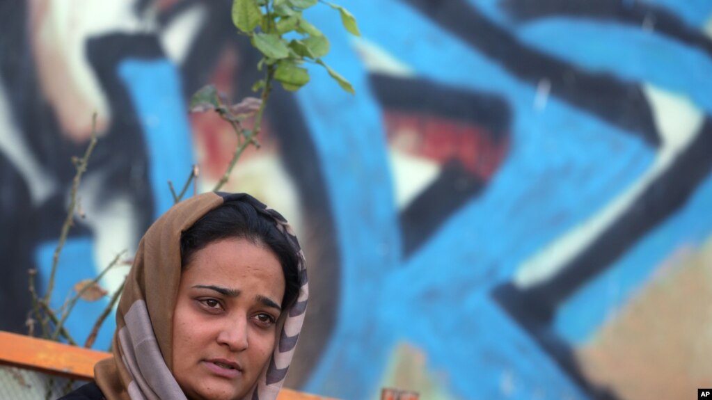 In this Oct. 9, 2015 photo, Parisa Aimaq, an Afghan female reporter for privately-owned Khawar Television, talks during an interview with The Associated Press at the Afghan Journalists' Safety Committee in Kabul. 