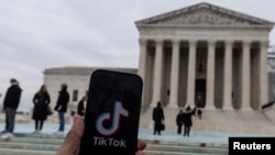 The TikTok logo is displayed on a mobile phone next to the U.S. Supreme Court, in this picture illustration