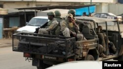 Soldiers of Ivory Coast's special forces drive through the city of Adiake, Ivory Coast, Feb. 7, 2017.