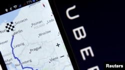 FILE - Nokia Maps is seen on a smartphone in front of a displayed logo of Uber in Zenica, Bosnia and Herzegovina, in this May 8, 2015 photo illustration.