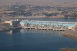 FILE - A general view shows the Tishrin Dam, south of Kobani, Syria, Dec. 27, 2015.