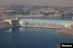 FILE - A general view shows the Tishrin Dam, east of Aleppo, Syria, Dec. 27, 2015.