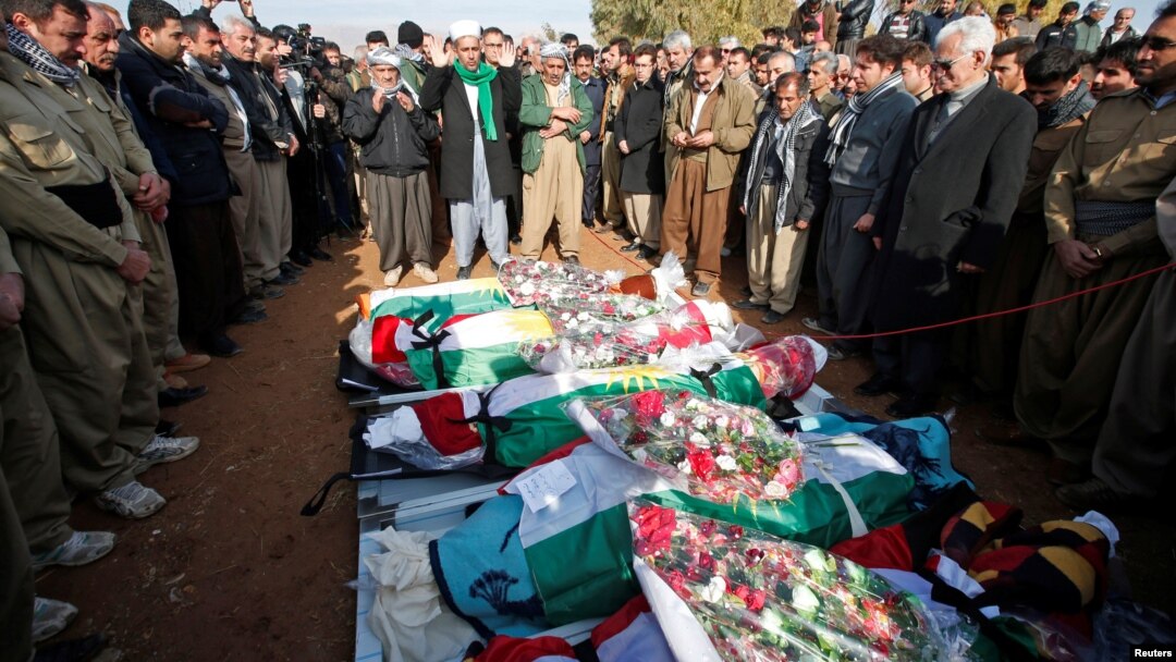 Mourners pray during a funeral of victims who were killed in a bomb attack at the offices of the Democratic Party of Iranian Kurdistan (PDKI) in Koy Sanjak, east of Erbil, Iraq, Dec. 21, 2016.