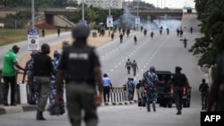 FILE - Nigerian police officers patrol in the streets of Abuja during clashes with members of the Shi'ite Islamic Movement of Nigeria, July 22, 2019. 