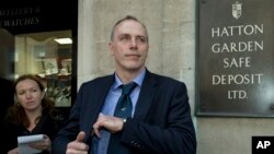 FILE - Detective Chief Inspector Paul Johnson of London's Metropolitan Police Service outside the Hatton Garden Safe Deposit, Ltd., April 9, 2015.
