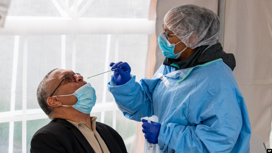 Democratic gubernatorial candidate Dr. Woody Myers takes a COVID-19 test at Aria Diagnostics, in Indianapolis, April 23, 2020.
