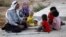 New Syrian refugees rest as they arrive at a stopover facility near the Turkish border town of Reyhanli in Hatay province, August 9, 2012. 