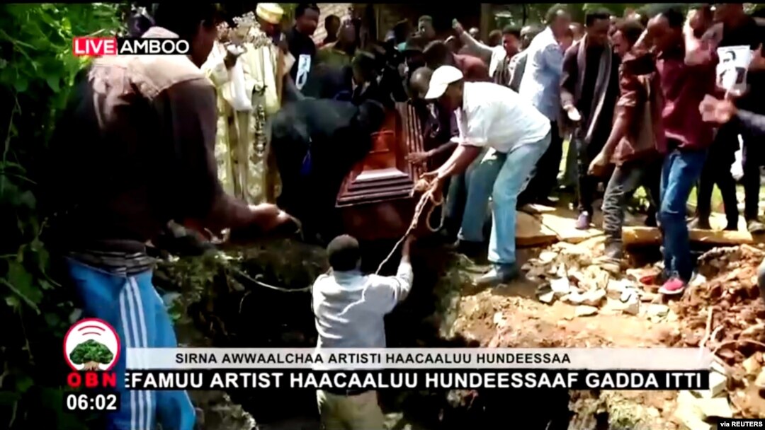 Ethiopian musician Haacaaluu Hundeessaa is buried in Ambo, Ethiopia, July 2, 2020, in this still image from a video.