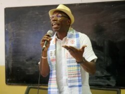 FILE - Presidential candidate Domingos Simoes Pereira holds a meeting with students at Lusophone university in Bissau, Guinea-Bissau, Nov. 21, 2019.