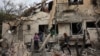 People check their family's damaged house at the scene where one of the projectiles fell, after they crossed over to Israel from Lebanon, amid ongoing hostilities between Hezbollah and Israel, in Rinatiya, Israel, Nov. 24, 2024.