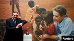 Sean Hepburn Ferrer, poses in front of a picture of his mother Audrey Hepburn and an Oscar statuette awarded posthumously for her humanitarian work at the exhibition "Intimate Audrey" in Brussels, Belgium, May 2, 2019. (REUTERS/Francois Lenoir)