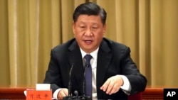 Presiden Xi Jinping memberikan pidato di Beijing, hari Rabu (2/1). 