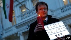 Richard Ratcliffe, husband of imprisoned charity worker Nazanin Zaghari-Ratcliffe, poses for the media during an Amnesty International-led vigil outside the Iranian Embassy in London, Jan. 16, 2017.