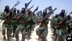 FILE - Al-Shabab fighters are seen marching with their weapons during exercises on the outskirts of Mogadishu, Somalia, Feb. 17, 2011. The Pentagon says a U.S. airstrike against al-Shabab in Somalia last Saturday killed more than 150 militants.