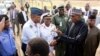 In this photo released by the Nigeria State House, Nigeria President Muhammadu Buhari, second right, is welcomed by Nigeria Service Chiefs, on arrival from his medical leave in London, in Abuja, Nigeria, March 10, 2017. 