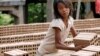 A Cambodian girl prepares bricks to dry under the sun light at a brick factory in Chheuteal village, Kandal province, some 27 kilometers (17 miles) north of Phnom Penh, Cambodia, Monday, May 2, 2011. 