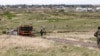 FILE - Emergency responders participate in an exercise at Buckley Space Force Base, Colorado, May 10, 2024.