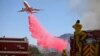 California Firefighters Continue Battling Blazes, Even as Winds Subside