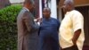 Rep Togba Mulbah (R) and George Mulbah (C) speak with VOA's James Butty (L)